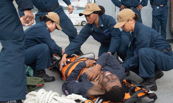 USS Blue Ridge (LCC-19) sailors secure an injured sailor